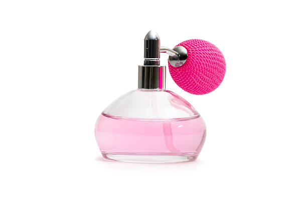 istock Round and short Bottle of pink perfume 94734125