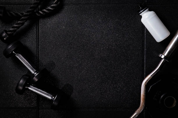 istock Gym equipment in gym Gym with dark background 947344130