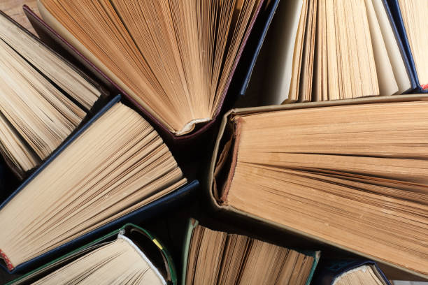 istock Background from old and used hardback books 947345182