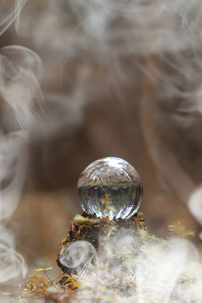 istock A crystal ball in the smoke. A magical accessory in the woods on 947347986