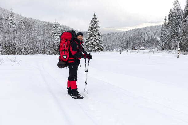 istock A backpacker on his way in the winter mountains 947348672