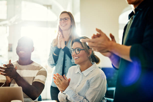 istock Smiling group of diverse coworkers clapping during an office presentation 947353148