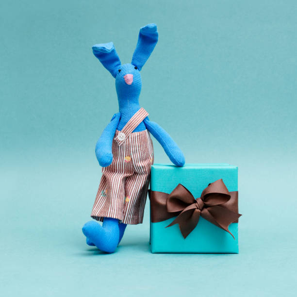 istock funny rabbit with a beautiful gift 947354004