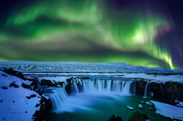 istock Northern Light, Aurora borealis at Godafoss waterfall in winter, Iceland. 947358448