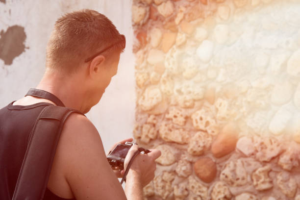 istock Summer, vacation. The photographer is working. 947362656