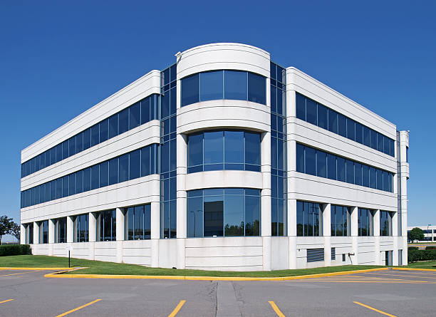 A generic white window building in an empty parking lot large modern building made of glass and concrete        federal building photos stock pictures, royalty-free photos & images
