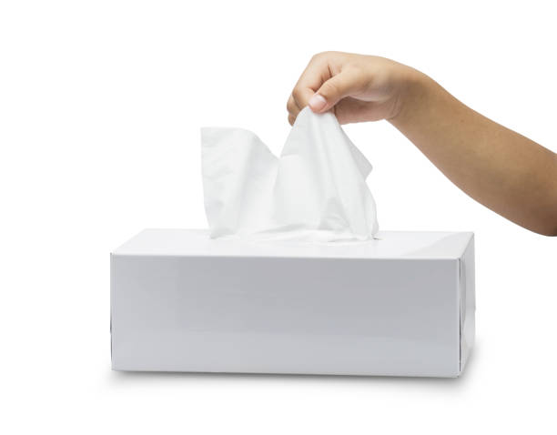 istock white tissue box isolated on white background and children's hand takes pulling paper. File contains a clipping path. 947368182
