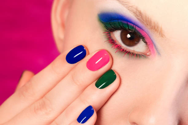 istock Blue pink green makeup and manicure. 947368998
