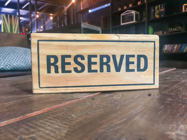 istock Signs Reservation on the table in the restaurant. 947372872