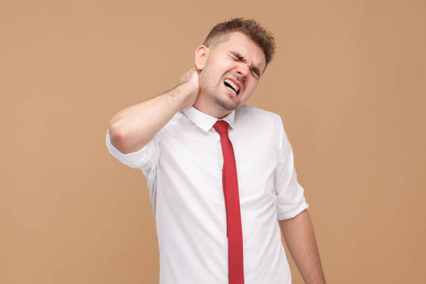 istock Sadness business man tired and have problem in neck 947373728
