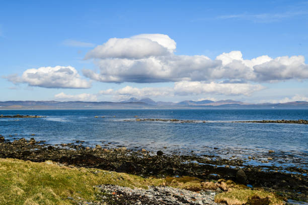 Entrance to Inishbofin Harbour , County Galway, Ireland. Ruins of Cromwell's Barracks guarding the harbour in the distance.