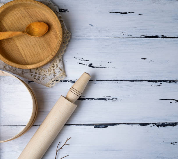 istock wooden round plates, sieve and rolling pin 947382856
