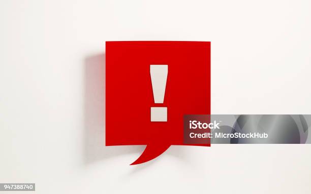 Red Chat Bubble With Exclamation Point On White Background Stock Photo - Download Image Now