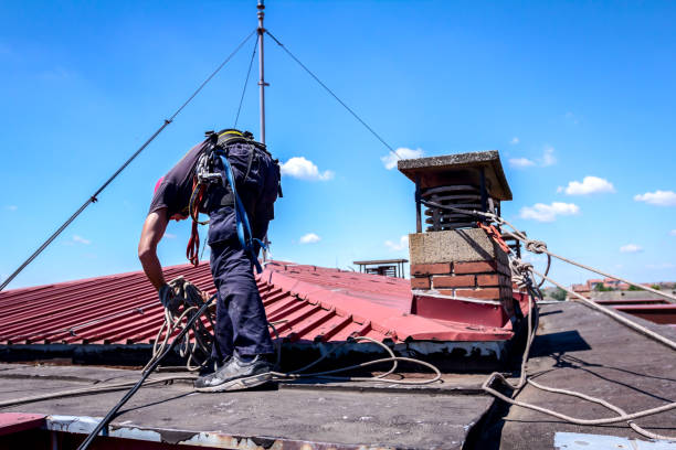 istock Industrial climber is bounding his ropes to the chimney made of bricks 947392904