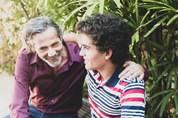 istock Father and son talking in the yard 947396814