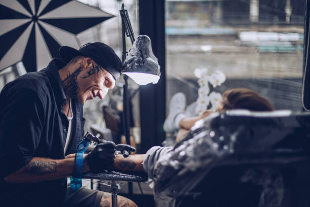 istock Tattoo artist working hard 947397372