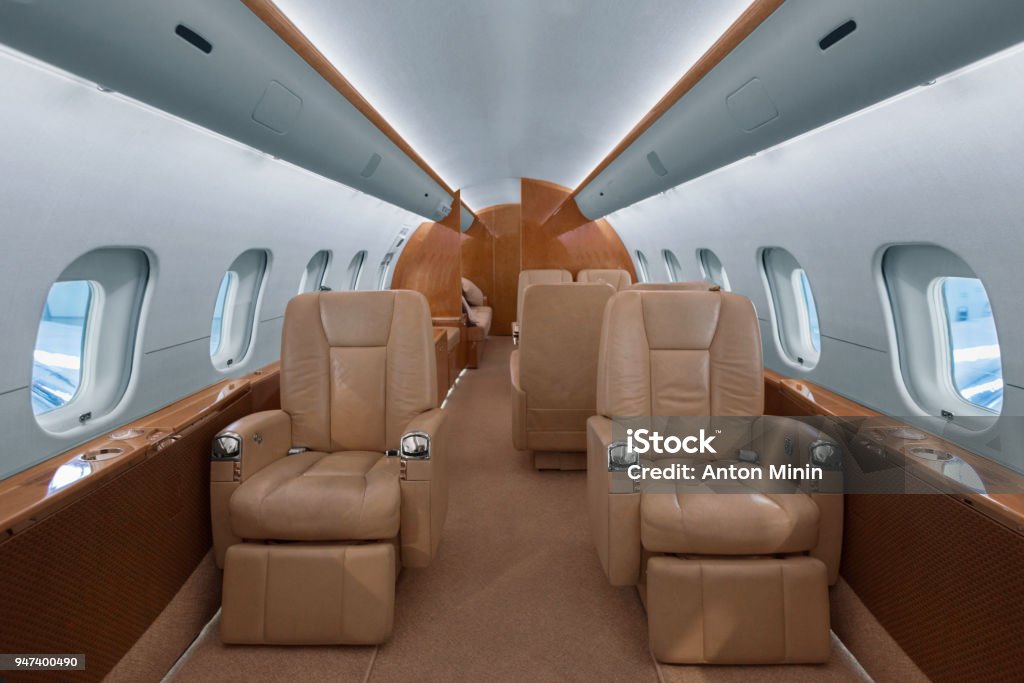 Business jet interior Business jet cabin with leather seats Corporate Jet Stock Photo