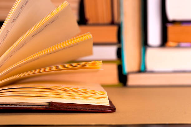 istock Open book, hardback books on bright colorful background. 947401830