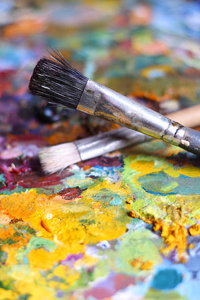 istock Colorful background with palette and paintbrushes 94740289