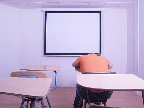 appassionato - sleeping high school desk education foto e immagini stock