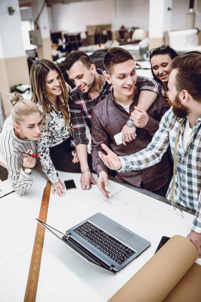 istock Creative Team in a Textile Factory Working on Laptop 947413576