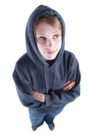 Young urban, casual dressed woman looking off into space with a disgusted expression; from above at a high angle; copy space