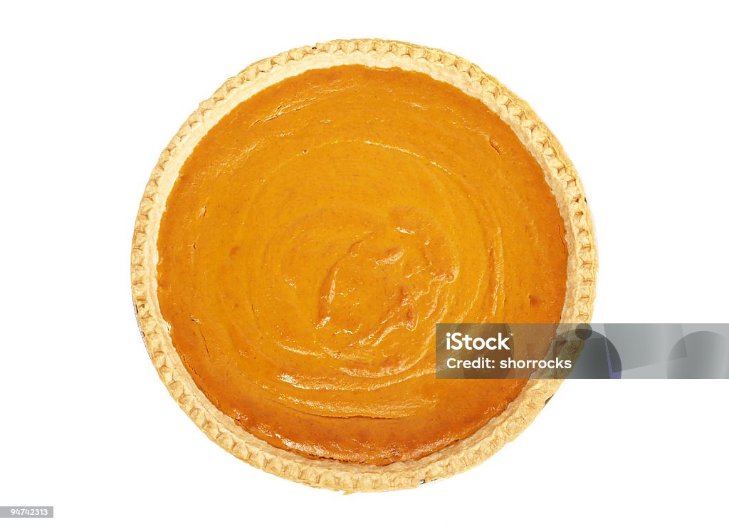 Pumpkin Pie from Above Whole pumpkin pie taken from directly above on a white background; whipped cream in center of pie; copy space  Pumpkin Pie Stock Photo