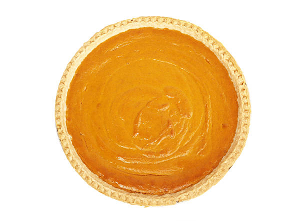 Pumpkin Pie from Above Whole pumpkin pie taken from directly above on a white background; whipped cream in center of pie; copy space  pumpkin pie stock pictures, royalty-free photos & images