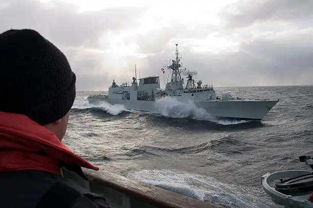 Photo of Warship in the middle of the sea