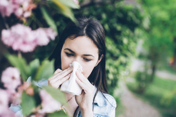 istock Woman blowing nose 947430826