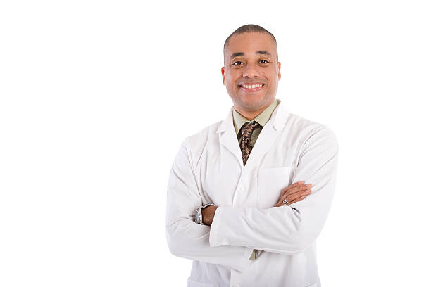 Medical Professional Half length photograph of an adult man in a lab coat and tie; could be a scientist, chemist, pharmacist, dentist, or doctor; copy space  laboratory coat stock pictures, royalty-free photos & images