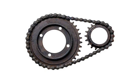 Old rusty chain gear, small and large collars. Isolated on a white background
