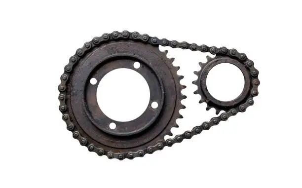 Photo of Old rusty chain gear, small and large collars. Isolated on a white background