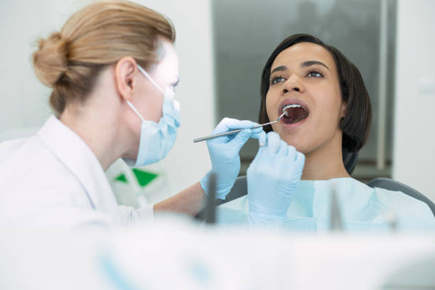 istock Attractive patient sitting with her mouth opened 947444746