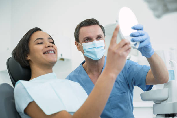 istock Satisfied patient looking in the mirror 947450936