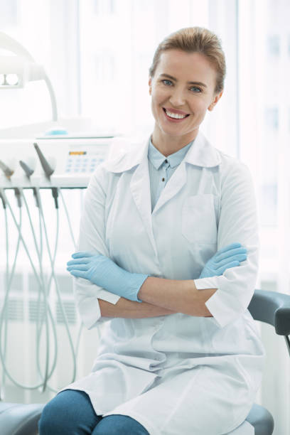 istock Inspired dentist sitting with her arms crossed 947452216