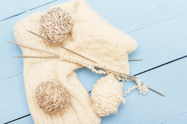 istock Warm handmade socks, knitted from sheeps wool. Top view 947455426