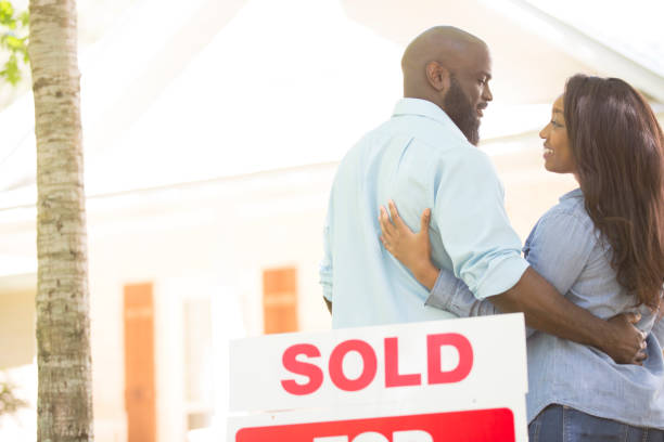 istock Couple moving into new home. 947462620