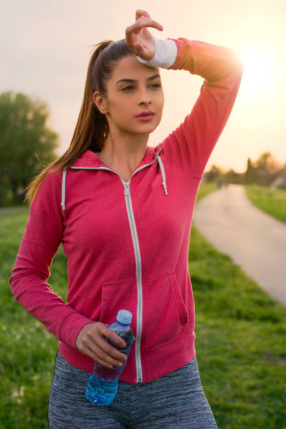 istock Young woman resting after jogging 947467080