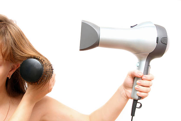 istock female hand holding hairdryer 94746730