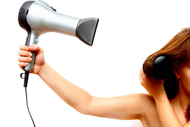 istock female hand holding hairdryer 94746735