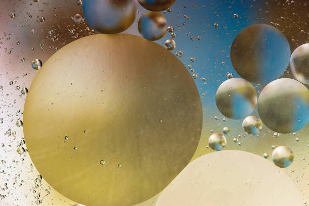 istock colorful oil bubbles on a water surface abstract background with blue 947478128