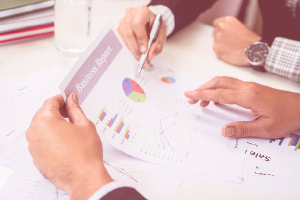 istock Team are working together analyzing business report 947479472