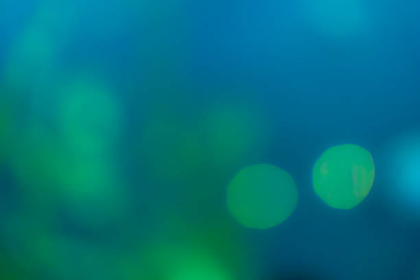 istock Green and blue blur bokeh abstract background 947479480