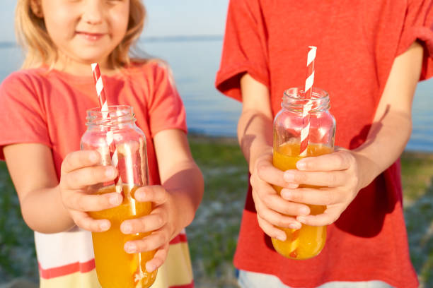 istock Fresh juice in bottles with drinking straws 947482090