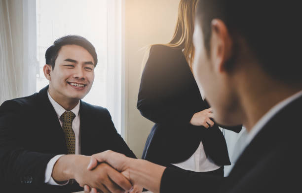 istock Happy business man with confidence hand shake with partner 947482188