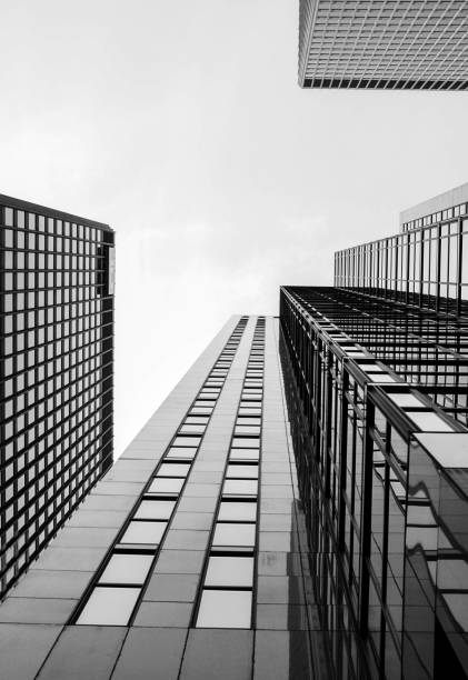 istock upward perspective of a tall skyscraper 947482738