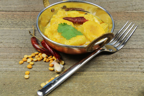 istock Kadhi, dumplings with yogurt sauce curry. 947484186