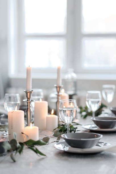 istock Wedding or festive table setting. Plates, wine glasses, candles and cutlery 947489970