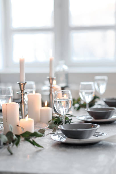 istock Wedding or festive table setting. Plates, wine glasses, candles and cutlery 947496478